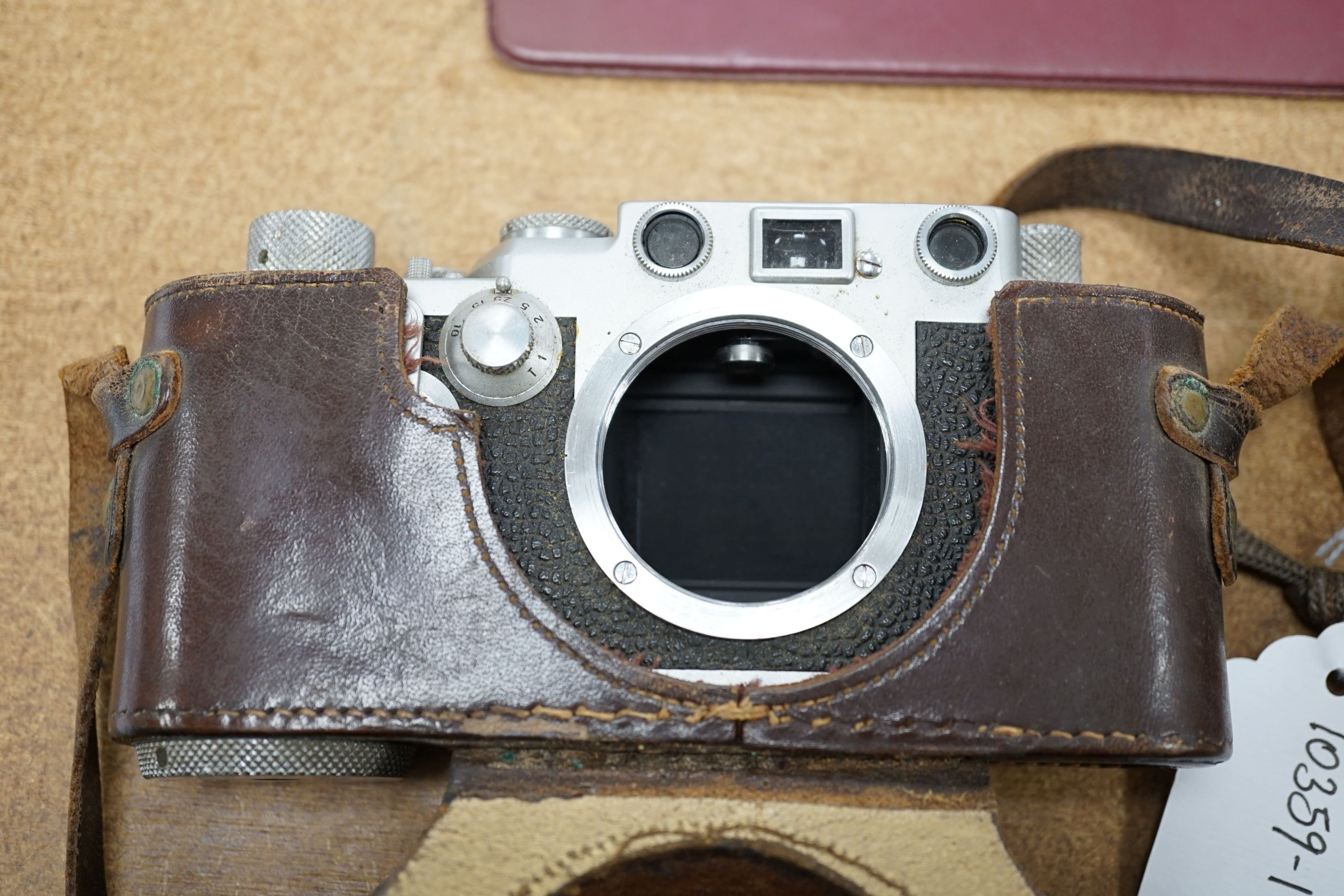 A cased Leica III camera serial number 767261 with Ernst Leitz GmbH Wetzlar Summarit f=5cm 1:15 No.135729 lens and light exposure meter